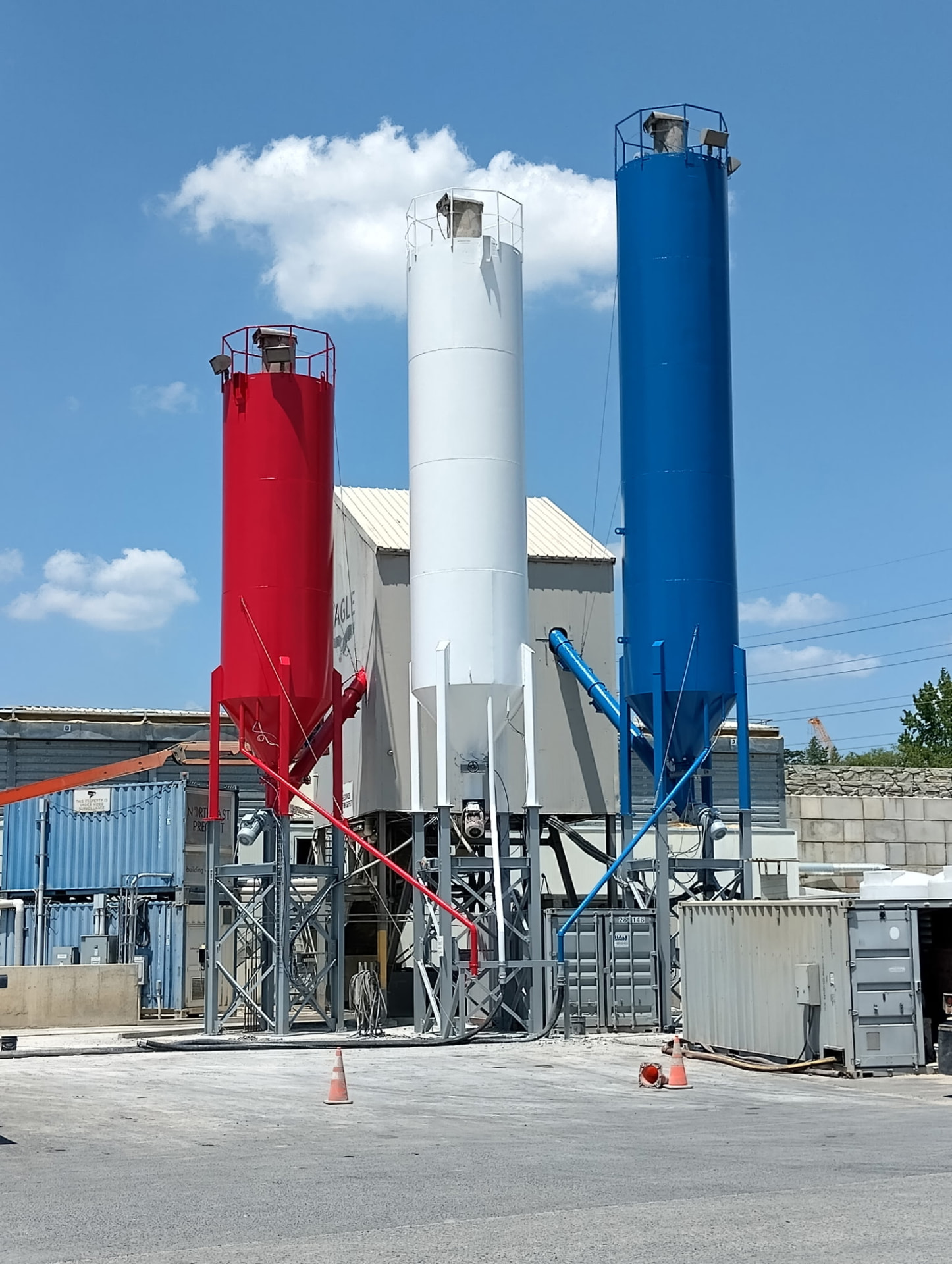 Coated cement silos at a precast plant